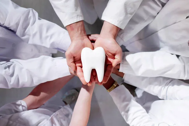 Portrait of Urs-P. Reber, the dental prosthetist behind the Bülach practice, smiling warmly — perfectly embodying the trust and personal care the article describes.