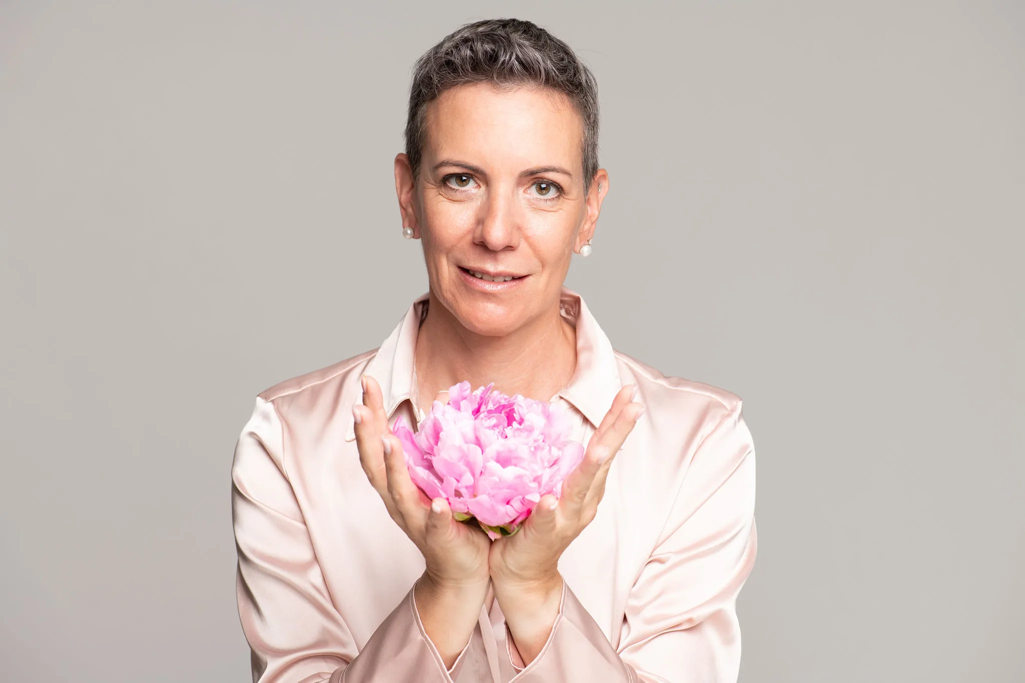 Karin Steiner Müller sits across from a client reviewing a health plan, perfectly illustrating ShapeUp's personalized one-on-one coaching approach for women.
