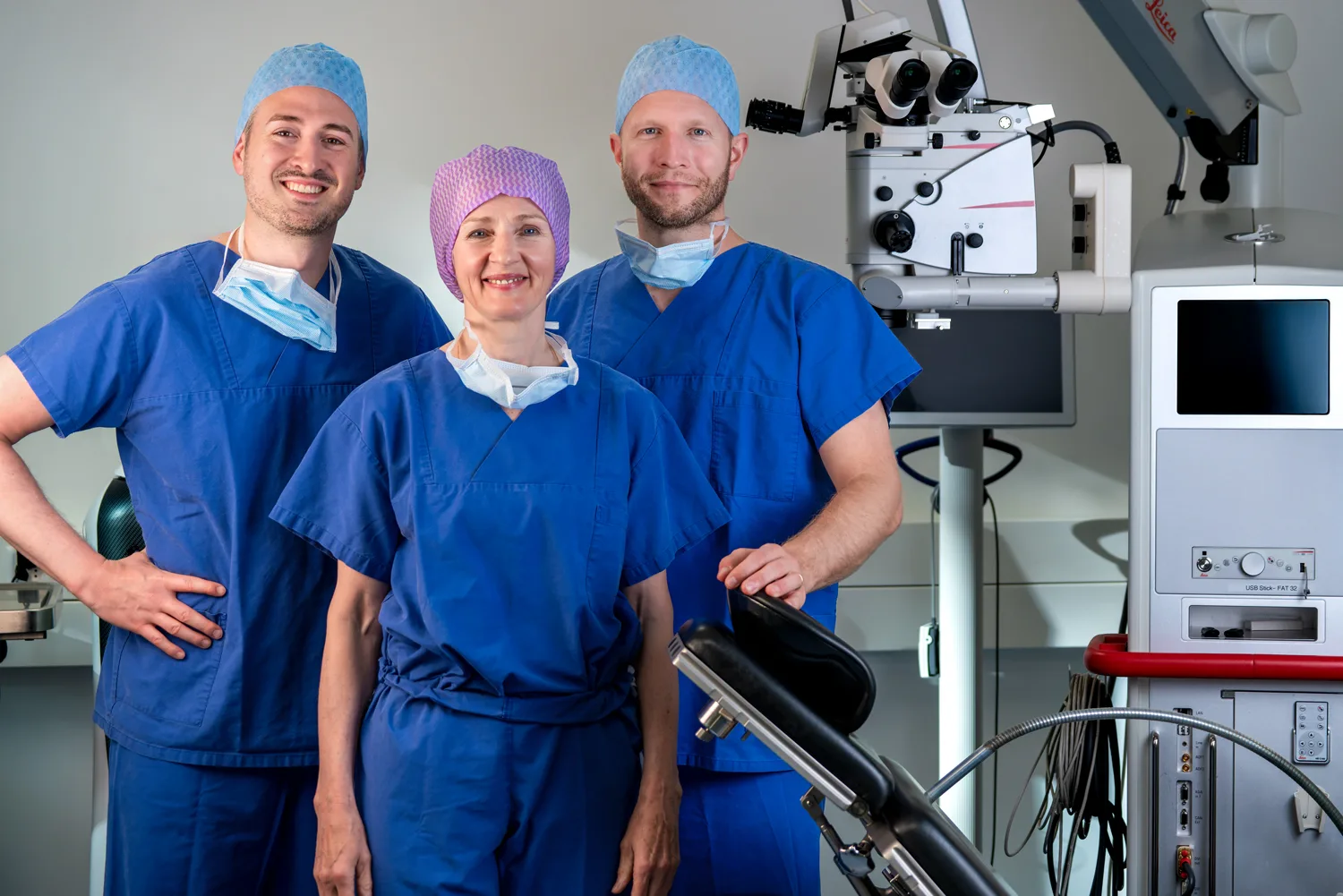 Professional team portrait of six IROC physicians in formal attire, establishing trust and showcasing the clinic's expert medical staff.
