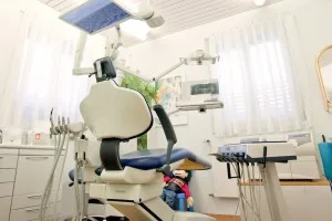 A modern dental milling machine used to fabricate ceramic restorations in-house.